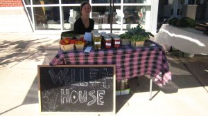 Well House urban gardener, Camilla Voelker, vending at the Southeast Area Farmers' Market.
